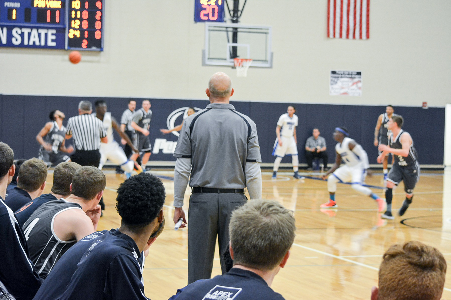 Head Coach Parrish Petry and the bench watch during the first half of the USCAA Final.