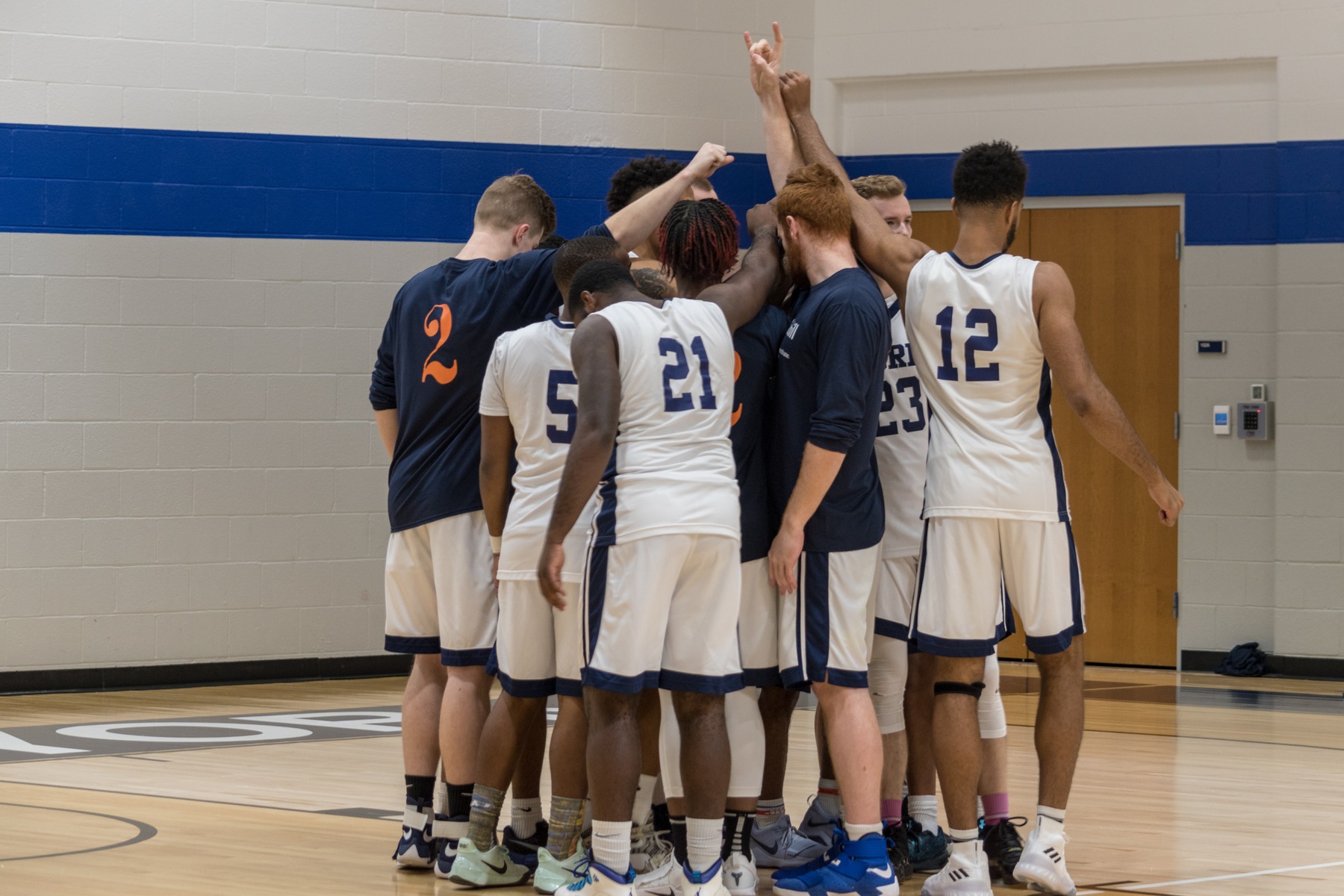 Penn State York Men’s Basketball huddles.
