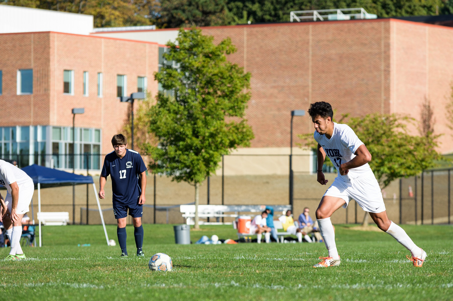 Senior Victor Rodriguez approaches the ball before slotting home the penalty kick.