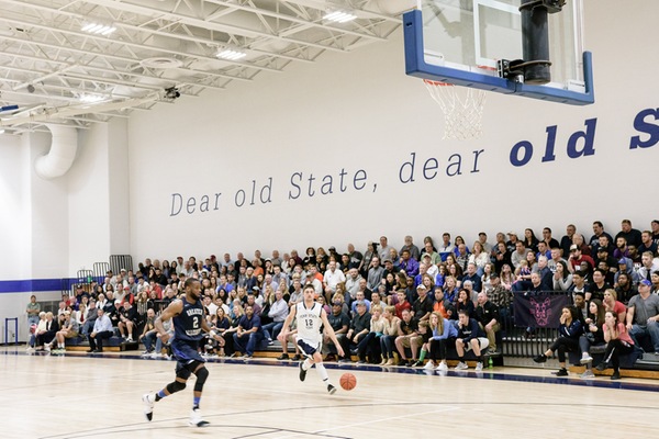 A Men’s Basketball game in the Joe and Rosie Ruhl Student Community Center Gymnasium.