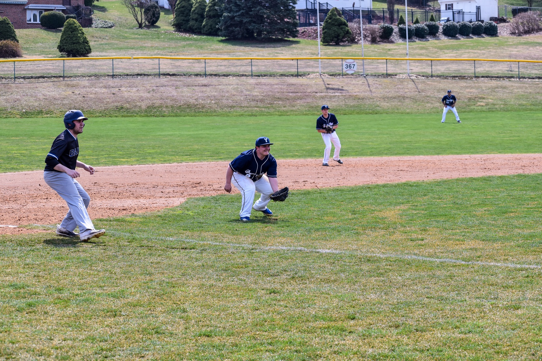 Senior Jonny Stratton looks to field a ground ball in the 12-2 loss.