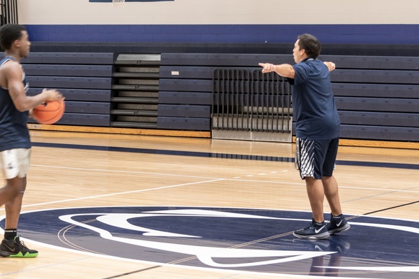 Matt Rotonda, Penn State York's new head men's basketball coach, gets out on the floor to demonstrate to players during a recent practice. The men open their season Nov. 1 at Stevens Tech.
Image: Barbara Dennis